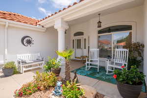 Covered front patio with sun shade