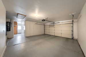 Two car garage with cupboards