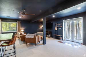 Bedroom with french doors, a textured ceiling, light carpet, access to outside, and ceiling fan