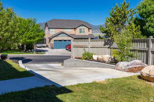 View of yard with a garage and a mountain view