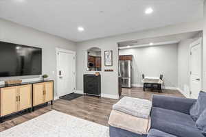 Living room featuring dark hardwood / wood-style flooring