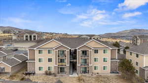 View of property with a mountain view