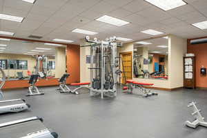 Workout area featuring a paneled ceiling