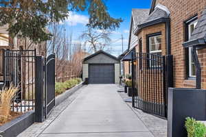 View of property exterior with an outbuilding and a garage