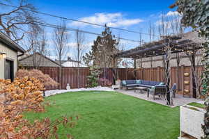 View of yard with a patio, an outdoor hangout area, and a pergola