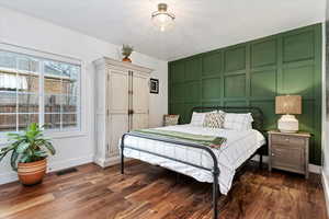 Bedroom featuring dark hardwood / wood-style floors