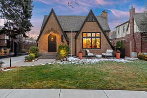 Tudor home featuring a lawn