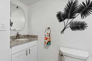 Bathroom with vanity and toilet