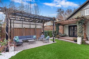 View of yard with french doors, a patio, an outdoor hangout area, and a pergola