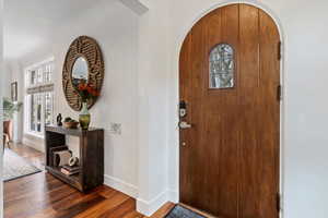 Foyer entrance featuring dark hardwood / wood-style flooring