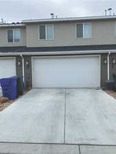 Front facade with a garage and central AC