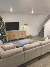 Living room with dark wood-type flooring