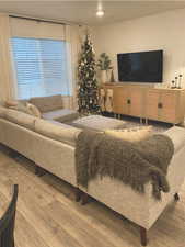 Living room with light hardwood / wood-style flooring