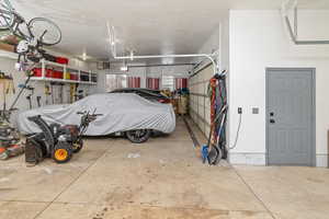 Garage featuring a garage door opener