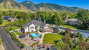 Birds eye view of property with a mountain view