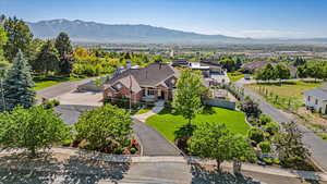 Birds eye view of property with a mountain view