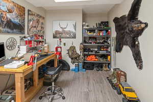 Office featuring hardwood / wood-style flooring