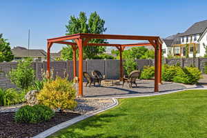 View of jungle gym with an outdoor fire pit and a lawn