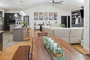 Dining space featuring lofted ceiling, light hardwood / wood-style floors, and ceiling fan