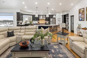 Living room with light wood-type flooring