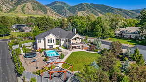 Birds eye view of property with a mountain view