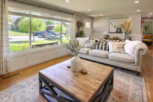 Living room with light hardwood / wood-style flooring