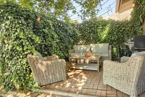 Wooden deck with a patio area and outdoor lounge area