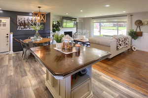 Dining room featuring a fireplace and light hardwood / wood-style floors