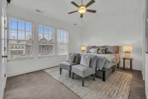 Bedroom with ceiling fan and lofted ceiling