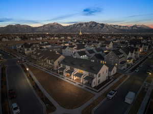 Aerial view at dusk featuring a mountain view