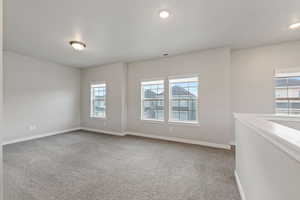 Spare room featuring carpet floors