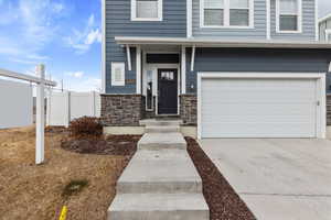 Entrance to property with a garage