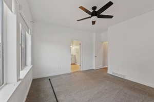 Unfurnished room with light carpet and ceiling fan