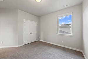 View of carpeted spare room