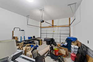 Garage featuring a garage door opener