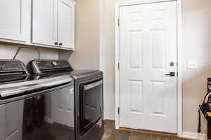 Laundry and Mud room with cabinets and separate washer and dryer