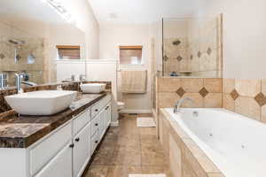 Primary bathroom with plus walk in shower, dual vanity