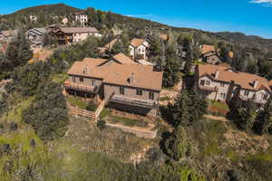 Birds eye view of property featuring a mountain view