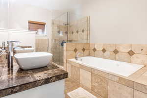 Primary Bathroom with shower with separate bathtub