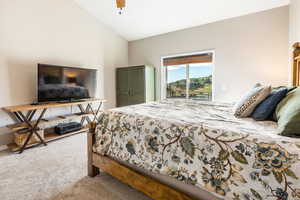 Primary Bedroom featuring lofted ceiling and ceiling fan