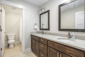 Bathroom featuring vanity and toilet