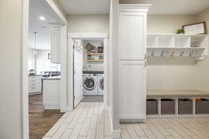 Clothes washing area with washer and clothes dryer