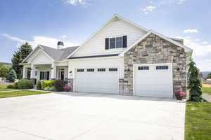 Craftsman house featuring a garage