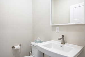 Bathroom featuring sink and toilet