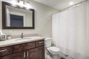 Bathroom with vanity and toilet