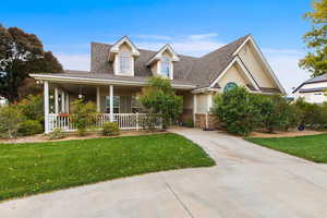 View of front of home featuring a porch and a front yard