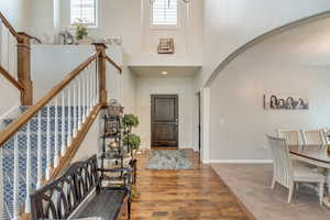 Foyer with a towering ceiling