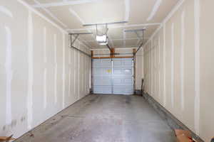 Garage featuring a garage door opener