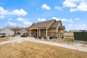 Craftsman inspired home with a porch and a front yard