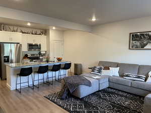 Living room with hardwood / wood-style flooring